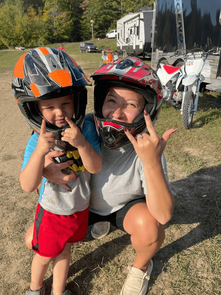 Family at the track with helmets on
